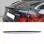 Juodas, blizgus spoileris skirtas BMW E71